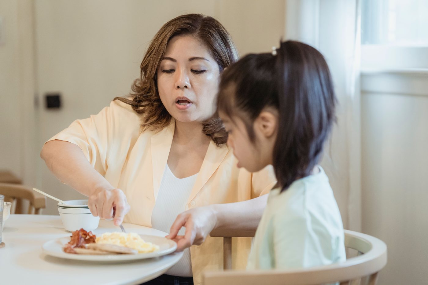 A mother and daughter at the breakfast table